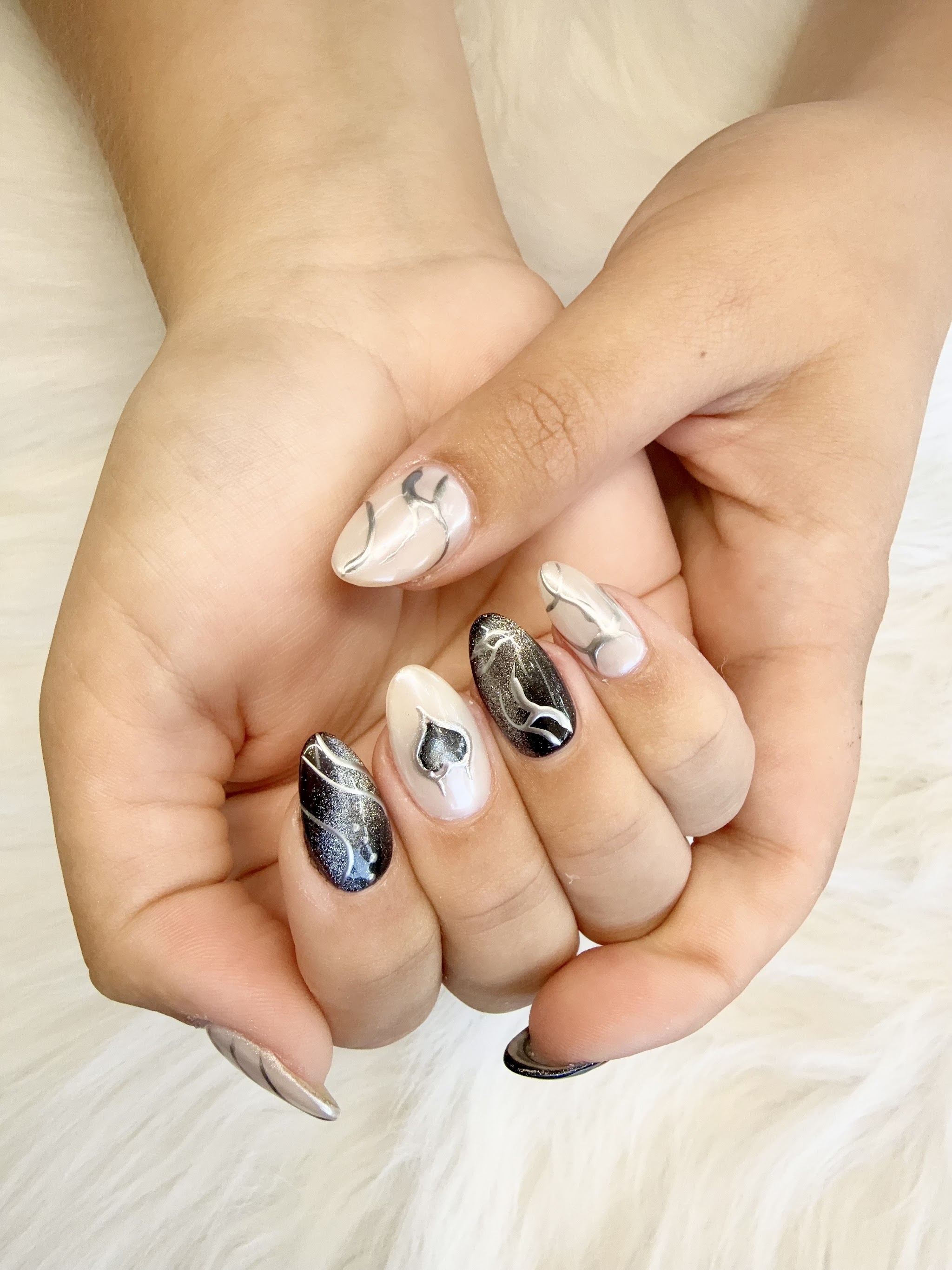 Almond nails with black and silver marble art
